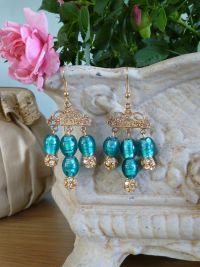Each earring is made using 4 glass foiled Jade beads and 3 gold plated crystal chatons hung from a filigree mount.  Price: &pound;31.73